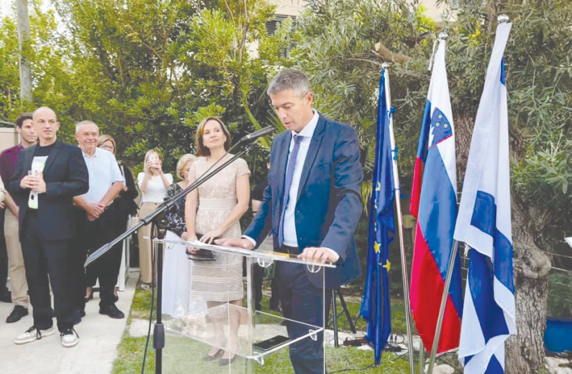  COMMUNICATIONS MINISTER Yoaz Hendel speaks at the Slovenian Independence Day reception, while Ambassador Andreja Purkart Martinez watches and listens.  (credit: SLOVENIAN EMBASSY)