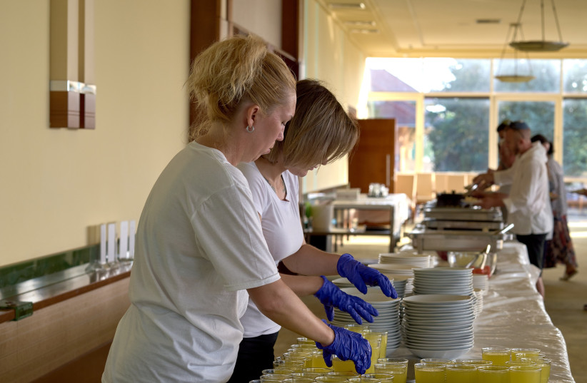  Women prepare kosher food for Jewish refugees from Ukraine in Balatonőszöd, Ukraine in June 2022.  (credit: COURTESY OF EMIH)