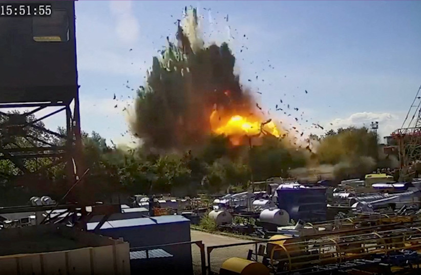  A view of the explosion as a Russian missile strike hits a shopping mall amid Russia's attack on Ukraine, at a location given as Kremenchuk, in Poltava Oblast, Ukraine in this still image taken from handout CCTV footage released June 28, 2022.  (credit: CCTV via Instagram @zelenskiy_official/Handout via REUTERS)