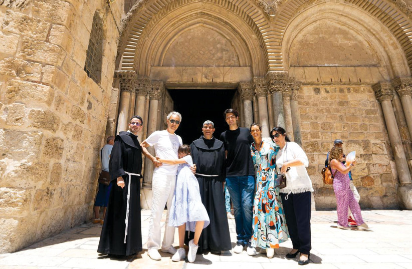  Bocelli and his family at the Church of the Holy Sepulcher. (photo credit: Shimmy Socol)