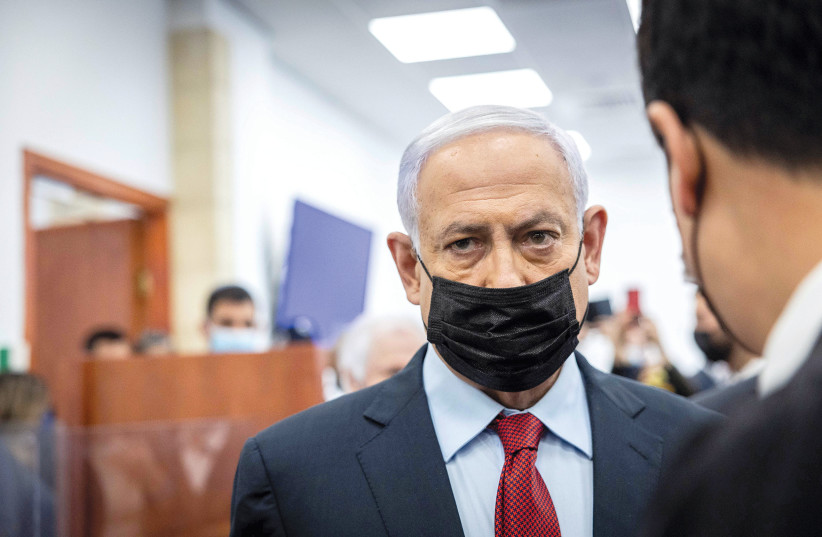  Israel's opposition leader Benjamin Netanyahu is seen in the Jerusalem District Court for his trial. (photo credit: YONATAN SINDEL/REUTERS)