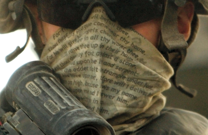  A US soldier in Iraq wearing a scarf with verses from Psalm 91. (credit: GORAN TOMASEVIC/REUTERS)
