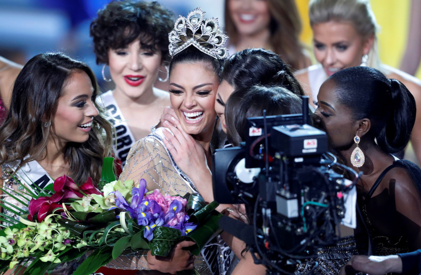 Miss South Africa Demi-Leigh Nel-Peters is congratulated by other contestants after being crowned Miss Universe at the 66th Miss Universe pageant at Planet Hollywood in Las Vegas, November 26, 2017.  (credit: STEVE MARCUS/REUTERS)