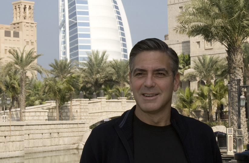  George Clooney poses before the opening of the fourth edition of the Dubai International Film Festival on December 9, 2007. (credit: REUTERS/STEVE CRISP)