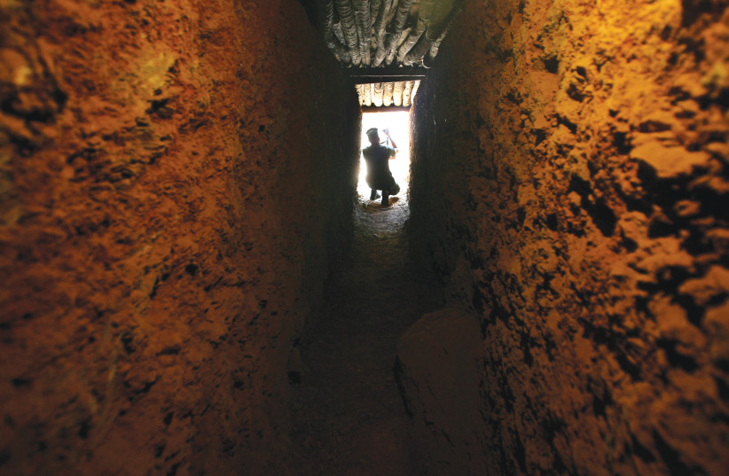  A SOLDIER guards the entrance of an underground shelter. The book details the many operations of the underground resistance against the Nazis (Illustrative).  (photo credit: JORGE SILVA / REUTERS)