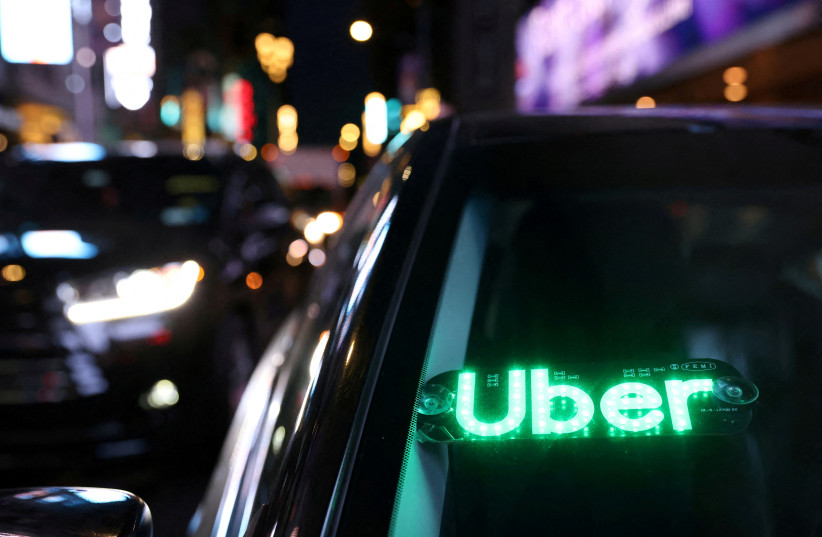  An unauthorised device displays a version of the Uber logo on a vehicle in Manhattan, New York City, New York, US, November 17, 2021. (photo credit: REUTERS/ANDREW KELLY)