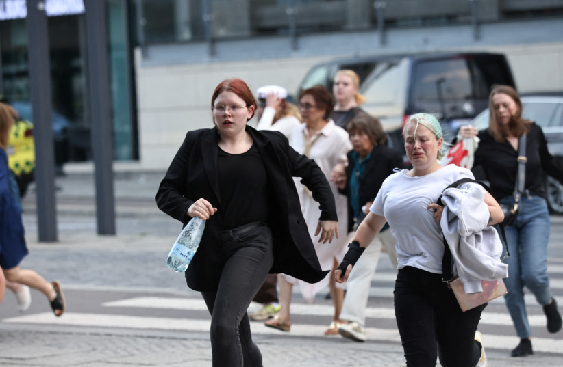  People leave Field's shopping centre, after Danish police said they received reports of shooting, in Copenhagen, Denmark, July 3, 2022 (credit: RITZAU SCANPIX/OLAFUR STEINAR RYE GESTSSON/REUTERS)