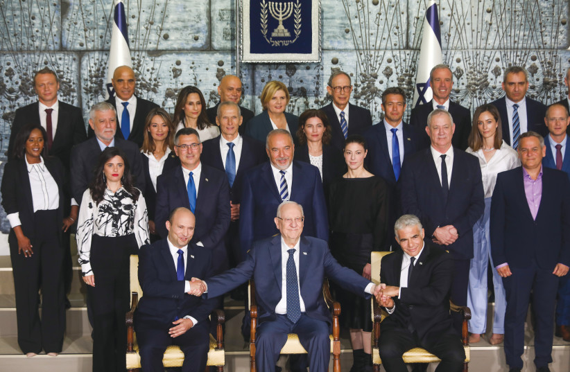  MEMBERS OF the Bennett-Lapid cabinet pose for a photo with then-president Reuven Rivlin, after their inauguration, in June 2021. (photo credit: YONATAN SINDEL/FLASH90)