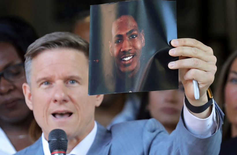  Attorney Bobby DiCello holds up a photograph of Jayland Walker, the man who was shot dead by Akron Police on June 25, as he speaks on behalf of the Walker family during a press conference at St. Ashworth Temple in Akron, Ohio, US June 30, 2022. (credit: JEFF LANGE/USA TODAY NETWORK VIA REUTERS)