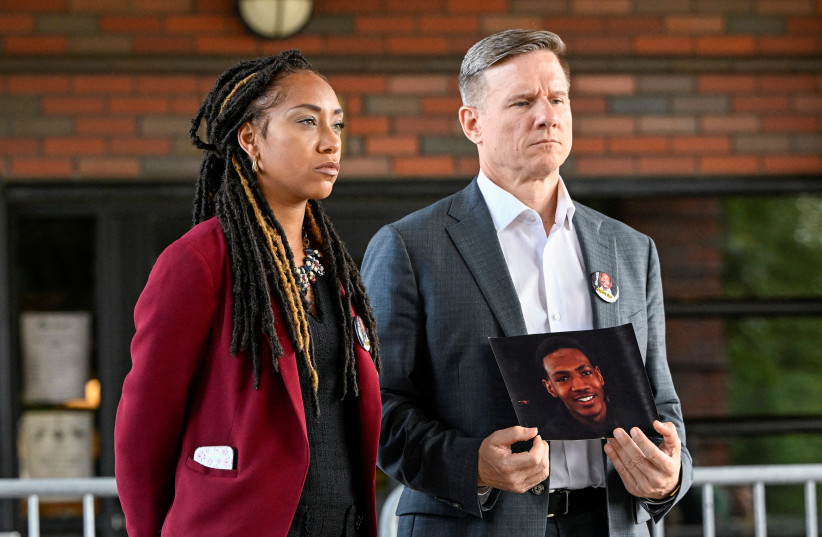  Elizabeth Paige White and Bobby DiCello holding a picture of Jayland Walker attend a news conference following the Akron police shooting death of Black man Jayland Walker in Akron, Ohio, US July 3, 2022. (photo credit: REUTERS/Gaelen Morse)