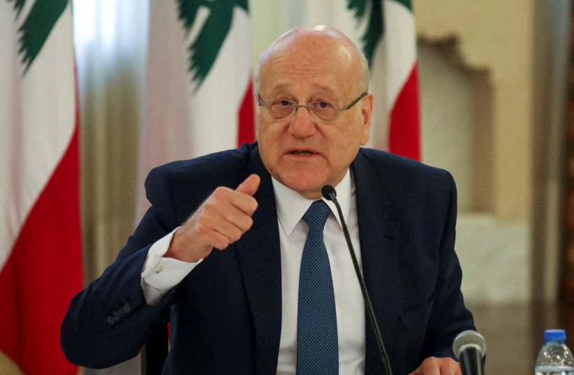 Lebanese Prime Minister Najib Mikati gestures during a news conference at the government palace in Beirut, Lebanon, December 28, 2021. (photo credit: REUTERS/MOHAMED AZAKIR/FILE PHOTO)