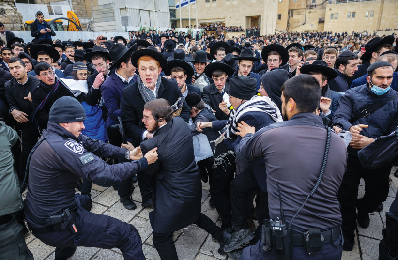  HAREDI PROTESTORS scuffle with police as the Women of the Wall movement holds Rosh Hodesh prayers at the Western Wall, in March. (credit: YONATAN SINDEL/FLASH90)