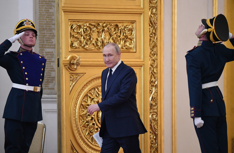 Russian President Vladimir Putin enters a hall in the Kremlin in Moscow on April 26, 2022.  (photo credit: NATALIA KOLESNIKOVA/AFP via Getty Images)