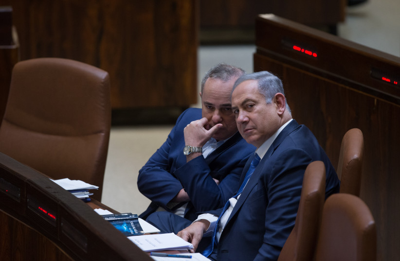  Then prime minister Benjamin Netanyahu seen with Minister of National Infrastructure, Energy and Water Resources Yuval Shteinitz (L) during a plenum session in the assembly hall of the Israeli parliament on March 7, 2016. (credit: YONATAN SINDEL/FLASH90)