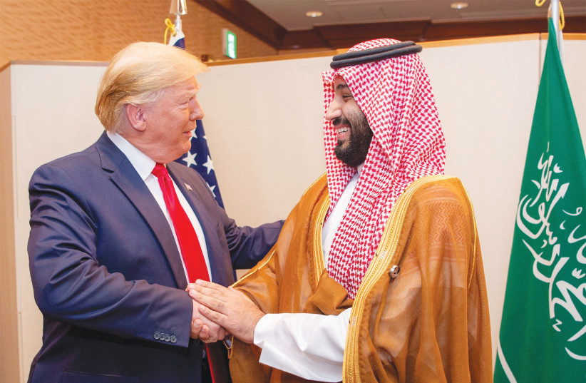  SAUDI ARABIA’S Crown Prince Mohammed bin Salman shakes hands with then-US president Donald Trump, 2019. (photo credit: Saudi Royal Court/Reuters)