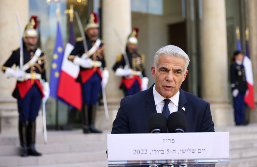  Israeli Prime Minister Yair Lapid delivers a joint statement with French President Emmanuel Macron before a meeting at the Elysee Palace in Paris, France, July 5, 2022. (credit: REUTERS/Johanna Geron)