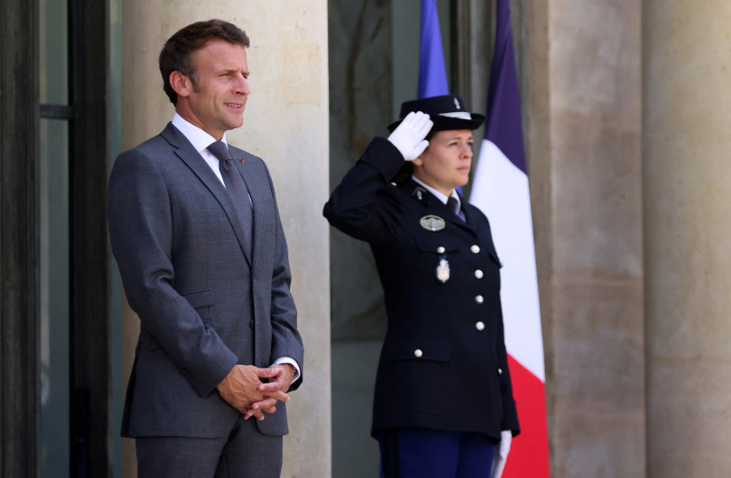  French President Emmanuel Macron waits for the arrival of Prime Minister Yair Lapid at the Elysee Palace in Paris, France, July 5, 2022. (credit: REUTERS/Johanna Geron)
