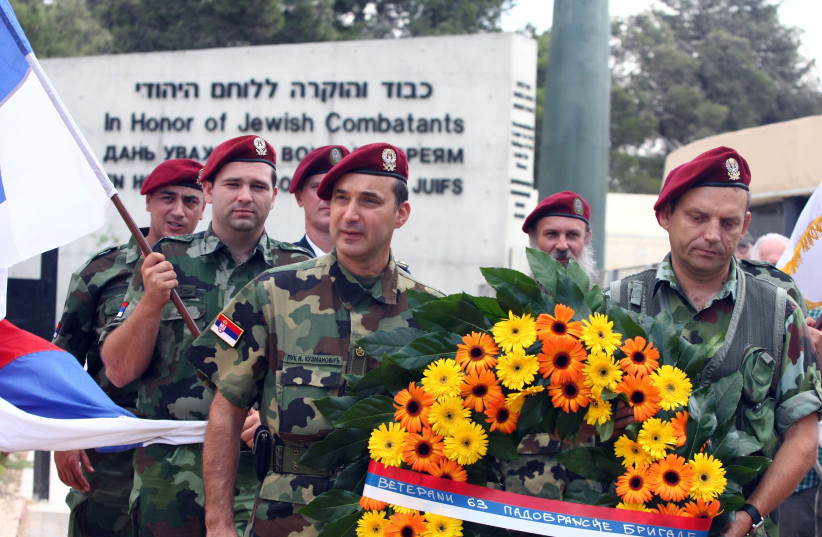  Serbian  paratrooper placing wreath in Ammunition Hill in honor of the Jewish soldiers that die in Six days war 1967 (photo credit: ABIR SULTAN/FLASH90)