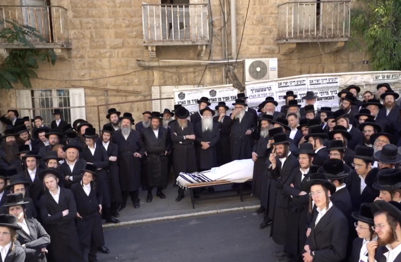  The body of Baruch Lebovits, a convicted child abuser, is visible at his funeral in Jerusalem, July 4, 2022.  (photo credit: LIVESTREAM VIA JTA)