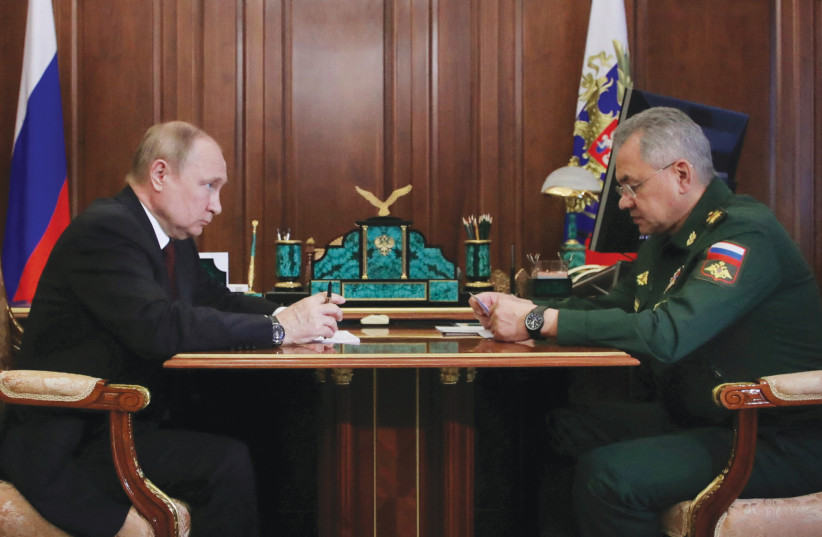  RUSSIAN PRESIDENT Vladimir Putin attends a meeting with Defense Minister Sergei Shoigu in Moscow, on Monday. (credit: Sputnik/Mikhail Klimentyev/Kremlin/Reuters)