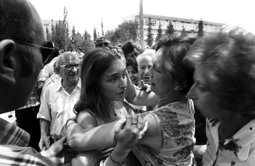  PASSENGERS RESCUED in the Entebbe raid are welcomed home by loved ones at Ben-Gurion Airport in July 1976.  (photo credit: REUTERS)