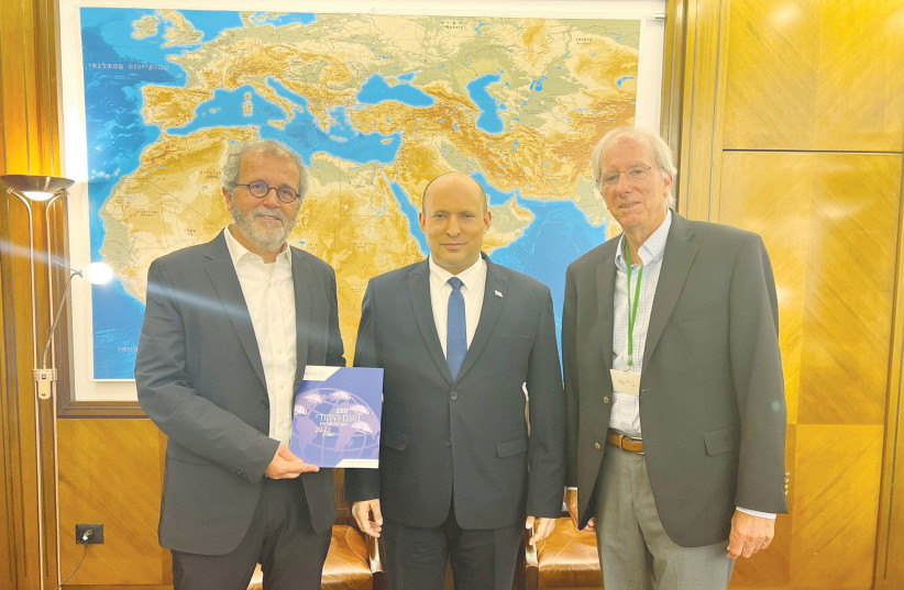  THE WRITER (left) and ambassador Dennis Ross present the JPPI Annual Assessment of the Situation and Dynamics of the Jewish People to then-prime minister Naftali Bennett. (photo credit: Courtesy)