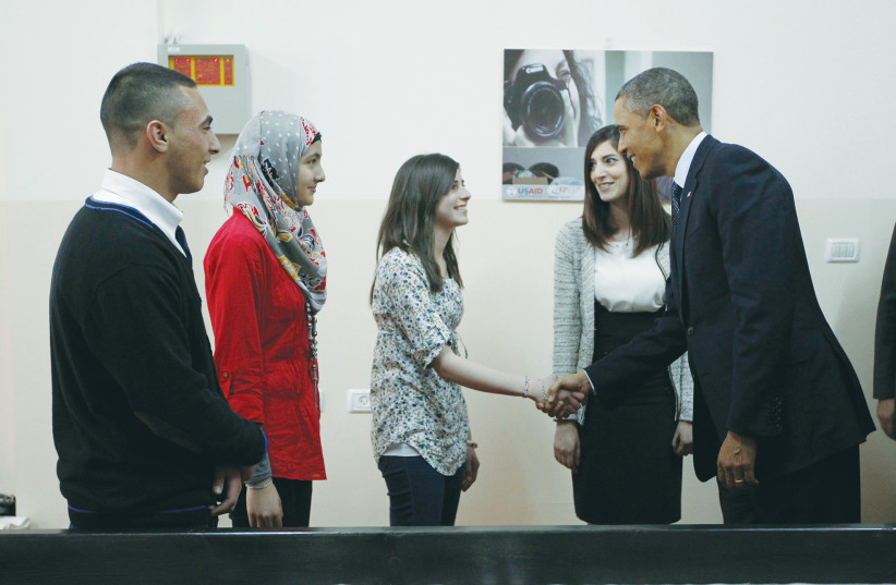  THEN-US PRESIDENT Barack Obama meets with Palestinians at a youth center in Ramallah, 2013. ‘Not even Obama’ visited east Jerusalem on his presidential trip, says the writer.  (photo credit: JASON REED/REUTERS)