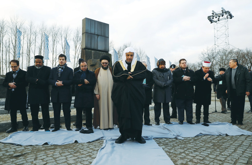  MOHAMMAD AL-ISSA, secretary-general of the Muslim World League, leads a prayer during a visit to Auschwitz-Birkenau, 2020. (photo credit: KACPER PEMPEL/REUTERS)