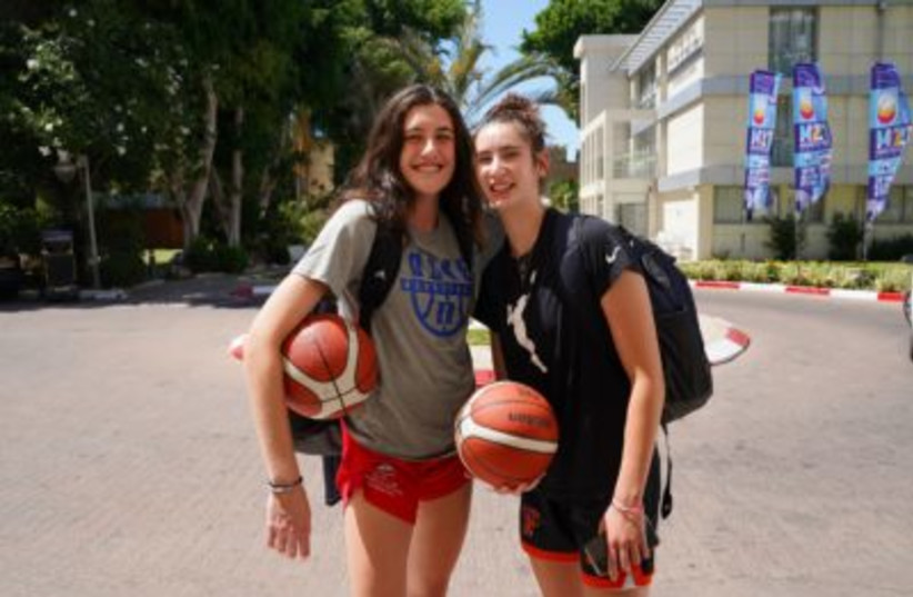  Basketball players Jaclyn Feit, left, of Charlotte North Carolina, and Sophie Gerber from Scottsdale, Arizona are looking forward to competing against other Jewish players.  (credit: GIL MEZUMAN/THE MEDIA LINE)