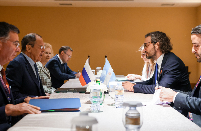  Russia's Foreign Minister Sergei Lavrov meets Argentina's Foreign Minister Santiago Cafiero during the G20 Foreign Ministers' Meeting in Nusa Dua, Bali, Indonesia July 8, 2022.  (photo credit: RUSSIAN FOREIGN MINISTRY/HANDOUT VIA REUTERS)