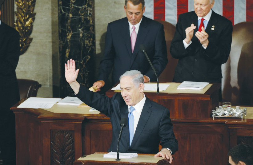  THEN-PRIME MINISTER Benjamin Netanyahu addresses a joint meeting of Congress in 2015. Bibi correctly calculated that maintaining consensus support for Israel in America did not necessitate a willingness to downplay opposition to Iran, says the writer. (photo credit: GARY CAMERON/REUTERS)