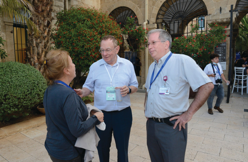  MOCHLY-ROSEN speaking to Prof. Rafael Beyar (middle) and Prof. Michael Halberthal. (credit: RAMBAM MEDICAL CENTER)