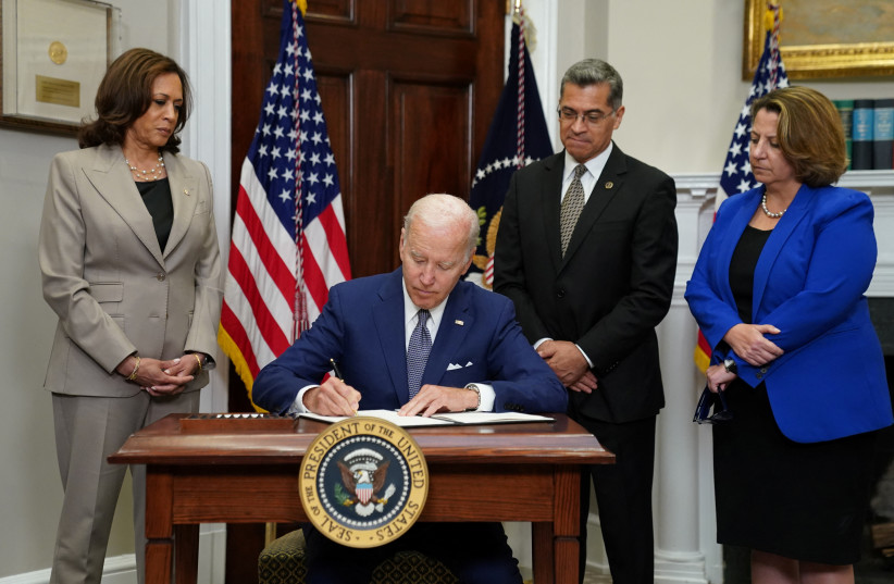  US President Joe Biden signs an executive order to help safeguard women's access to abortion and contraception after the Supreme Court last month overturned Roe v Wade decision that legalized abortion  (photo credit: REUTERS/KEVIN LAMARQUE)