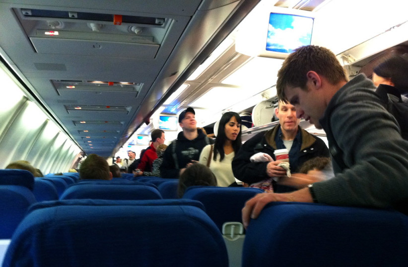  Passengers board an airplane. (photo credit: FLICKR)