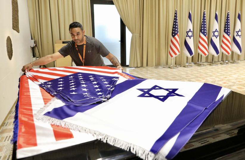  Flags being prepared for US President's Joe Biden's visit to Israel. (credit: MARC ISRAEL SELLEM/THE JERUSALEM POST)