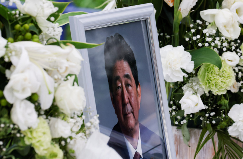  A picture of late former Japanese Prime Minister Shinzo Abe, who was shot while campaigning for a parliamentary election, is seen at Headquarters of the Japanese Liberal Democratic Party in Tokyo, Japan July 12, 2022 (credit: REUTERS/KIM KYUNG-HOON)