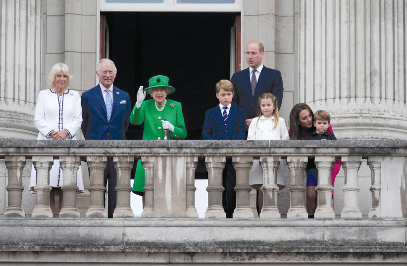Camilla, Prince Charles, Queen Elizabeth, Prince George, Prince William, Princess Charlotte, Prince Louis and Catherine, Duchess of Cambridge stand on the balcony during the Platinum Pageant, marking the end of the Platinum Jubilee celebrations, in London on June 5.  (credit: FRANK AUGSTEIN/REUTERS)