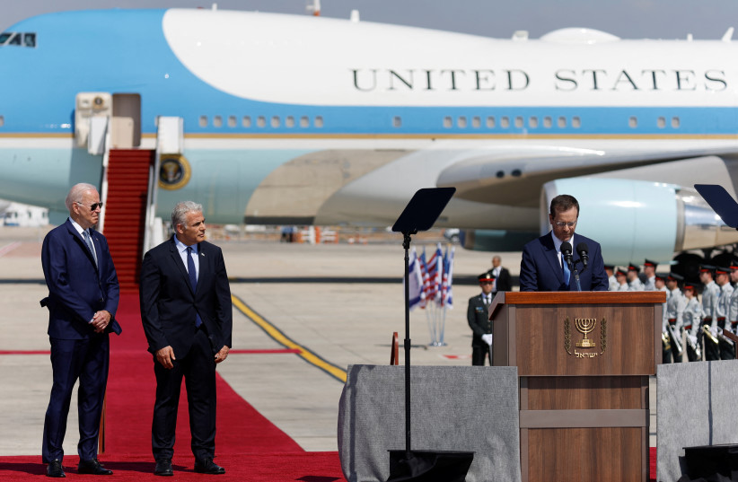  President Isaac Herzog speaks to US President Joe Biden as he lands for a three-day visit, at Ben Gurion International Airport in Lod near Tel Aviv, Israel, July 13, 2022 (photo credit: REUTERS/AMIR COHEN)