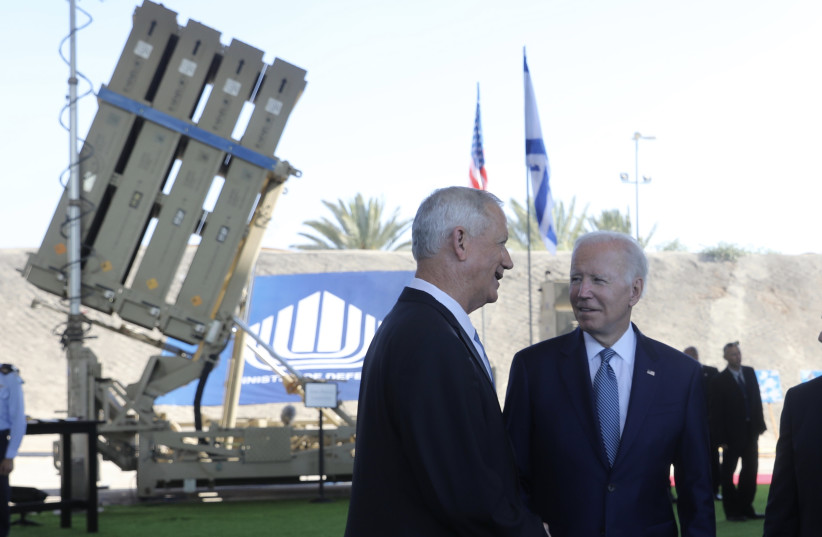 Defense Minister Benny Gantz and US President Joe Biden attend a briefing on the Israel's Iron Dome and Iron Beam Air Defense Systems at the Ben Gurion International Airport in Lod, near Tel Aviv, Israel, July 13, 2022 (photo credit: MARC ISRAEL SELLEM/POOL)