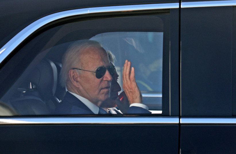  US President Joe Biden waves as he leaves Israel's Ben Gurion Airport, on his way to Jersualem, near Tel Aviv, Israel, July 13, 2022 (credit: GIL COHEN-MAGEN/POOL VIA REUTERS)