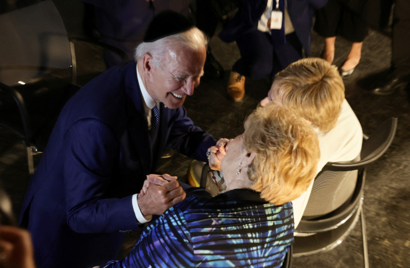  US President Joe Biden meets with holocaust survivors Dr. Gita Cycowicz and Rena Quint during his visit to the Yad Vashem Holocaust Remembrance Center in Jerusalem, July 13, 2022 (photo credit: REUTERS/EVELYN HOCKSTEIN)