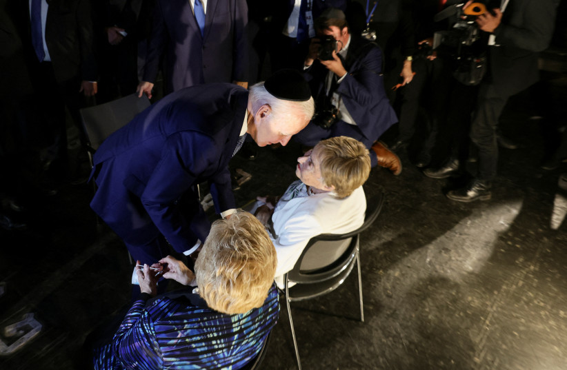  US President Joe Biden meets with holocaust survivors Dr. Gita Cycowicz and Rena Quint during his visit to the Yad Vashem Holocaust Remembrance Center in Jerusalem, July 13, 2022 (credit: REUTERS/EVELYN HOCKSTEIN)