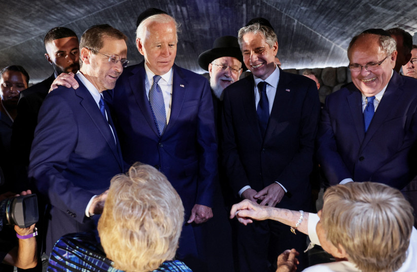 President Isaac Herzog, US President Joe Biden, US Secretary of State Antony Blinken and Yad Vashem Chairman Dani Dayan, meet with holocaust survivors Dr. Gita Cycowicz and Rena Quint during their visit to the Yad Vashem Holocaust Remembrance Center in Jerusalem, July 13, 2022 (credit: REUTERS/EVELYN HOCKSTEIN)