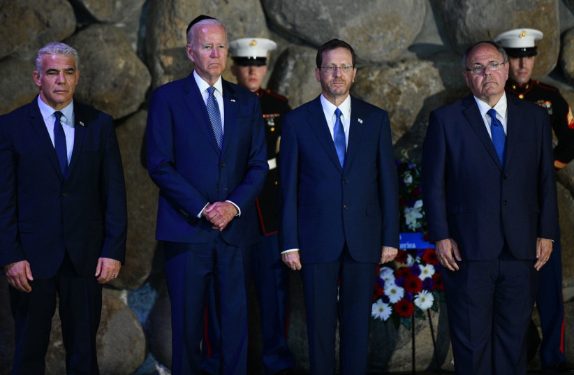 US president Joe Biden, Prime Minister Yair Lapid, Israeli president Isaac Herzog and Minister of Defense Benny Gantz visit at the Yad Vashem Holocaust memorial in Jerusalem on July 13, 2022 (credit: CHAIM ZACH / GPO)