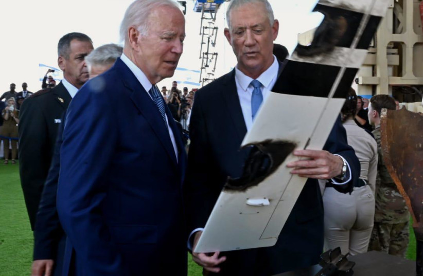  Defense Minister Benny Gantz shows US President Joe Biden a part of a UAV that was intercepted by the Iron Beam laser defense system (photo credit: DEFENSE MINISTRY)