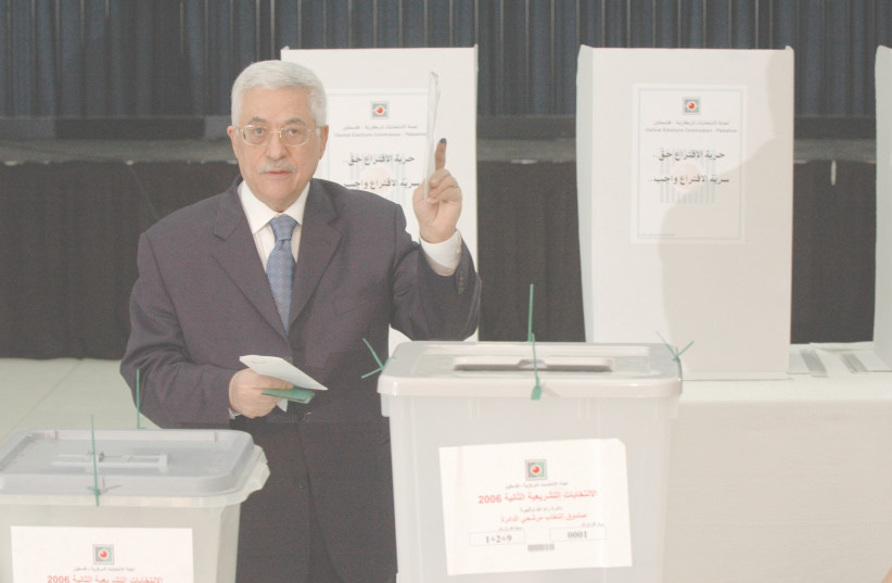 PALESTINIAN AUTHORITY head Mahmoud Abbas casts his vote in the 2006 Palestinian parliamentary election, in Ramallah. (photo credit: YOSSI ZAMIR/FLASH90)