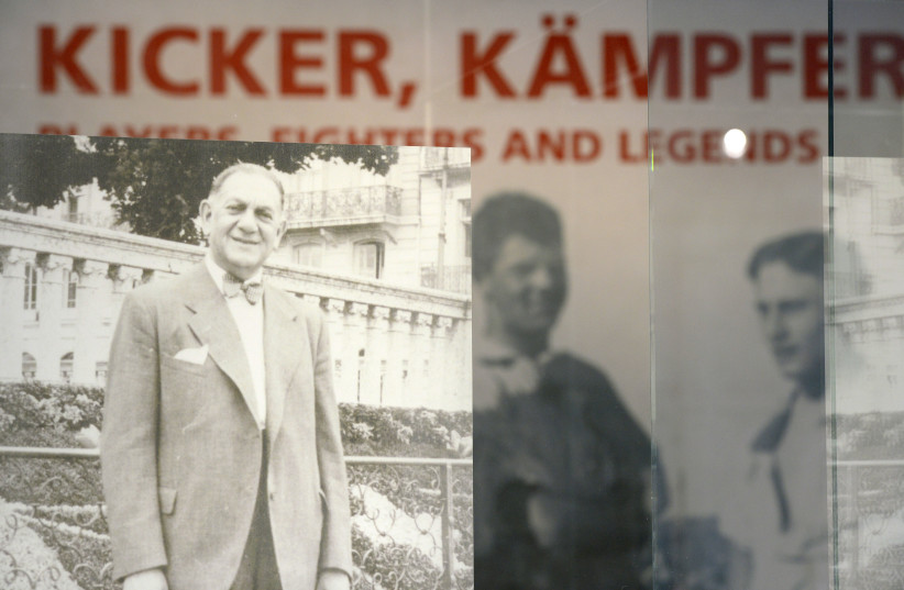 A photo depicting Kurt Landauer is shown at an exhibition titled ''Players, Fighters and Legends - Jews in the German football and at the Bayern Munich'' at the FC Bayern Erlebniswelt museum in 2015.  (credit: Christof Stache/AFP via Getty Images)