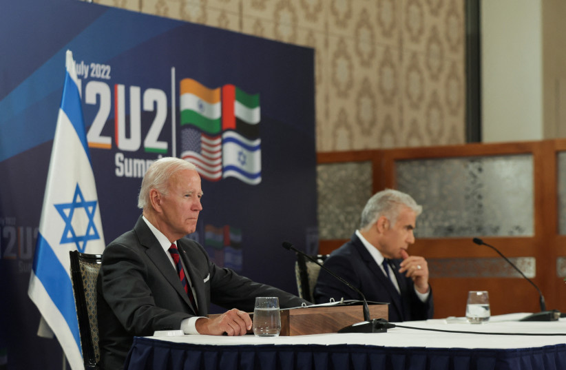 US President Joe Biden and Israeli Prime Minister Yair Lapid attend the first virtual meeting of the ''I2U2'' group with leaders of India and the United Arab Emirates, in Jerusalem, July 14, 2022  (credit: EVELYN HOCKSTEIN/REUTERS)