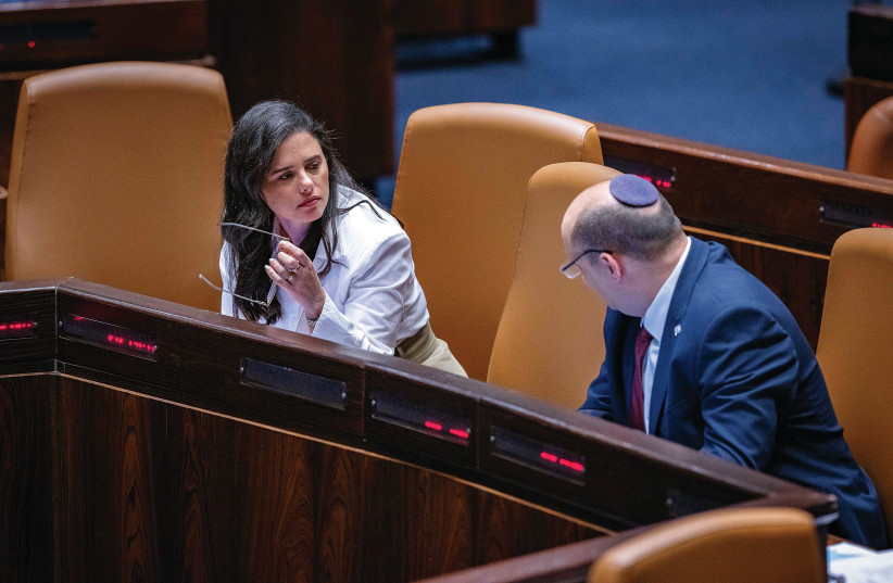  THEN-PRIME MINISTER Naftali Bennett speaks to Interior Minister Ayelet Shaked in the Kneset plenum, in May. (credit: OLIVIER FITOUSSI/FLASH90)