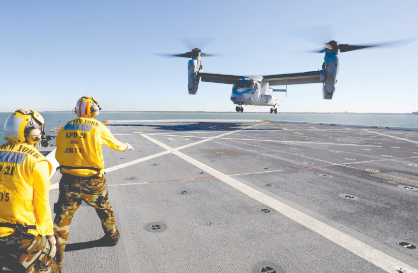  A V-22 in action.  (photo credit: Corey Lewis/US Navy)